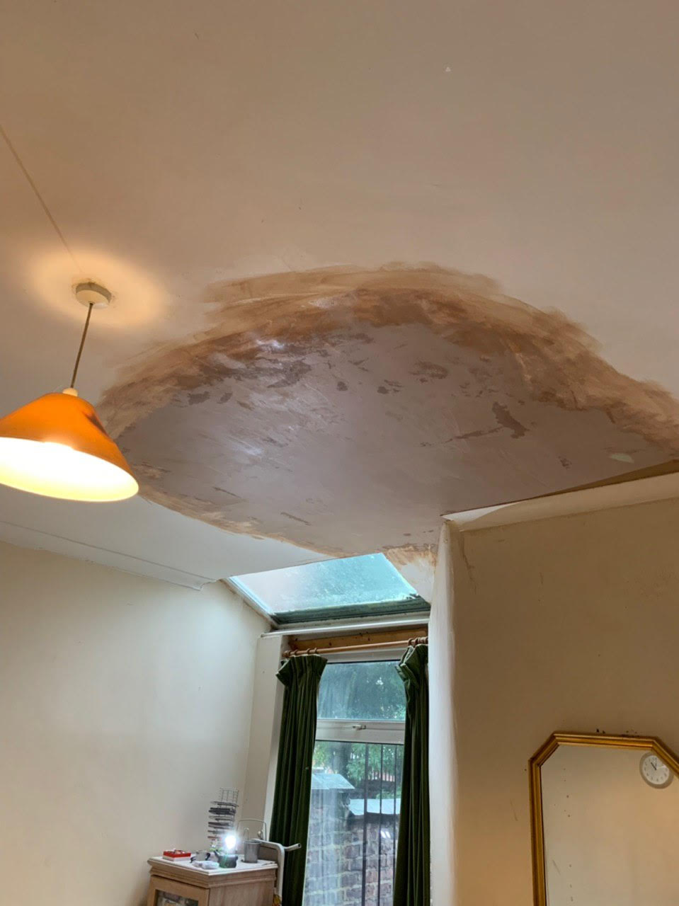 Water damaged ceiling due to a leak 2
